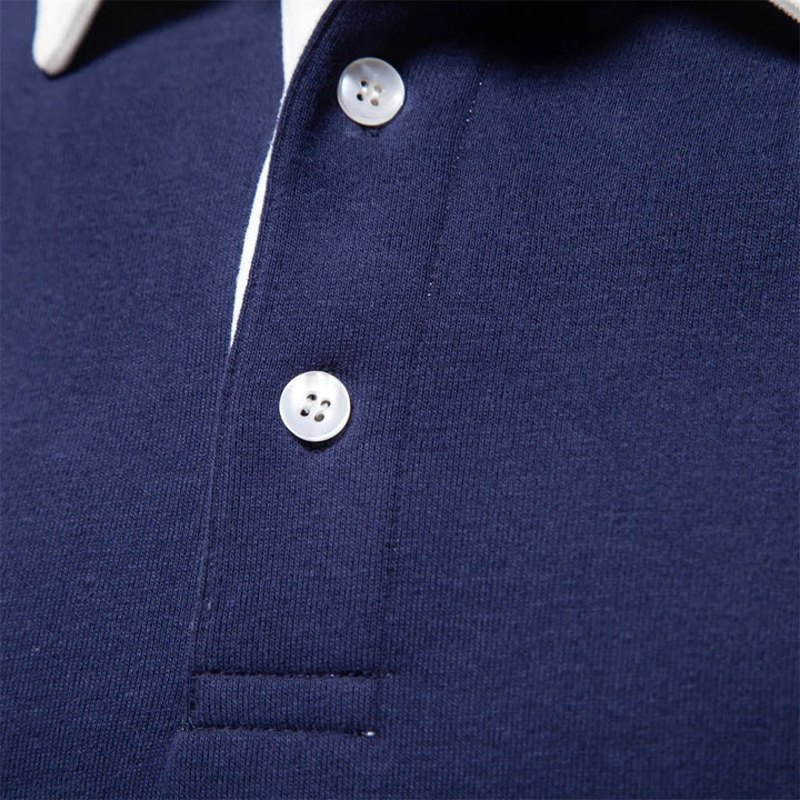 Dunkelblaues Langarm-Poloshirt mit weißem Kontrastkragen