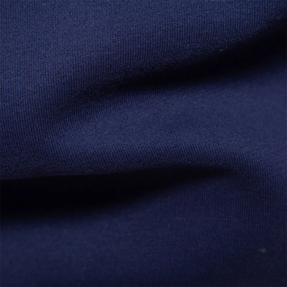 Dunkelblaues Langarm-Poloshirt mit weißem Kontrastkragen