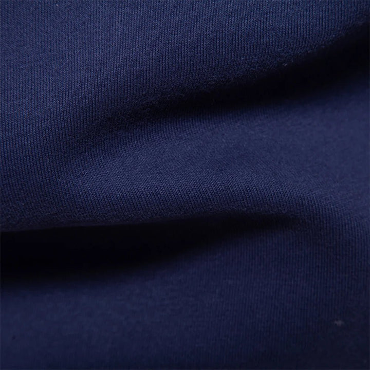 Dunkelblaues Langarm-Poloshirt mit weißem Kontrastkragen